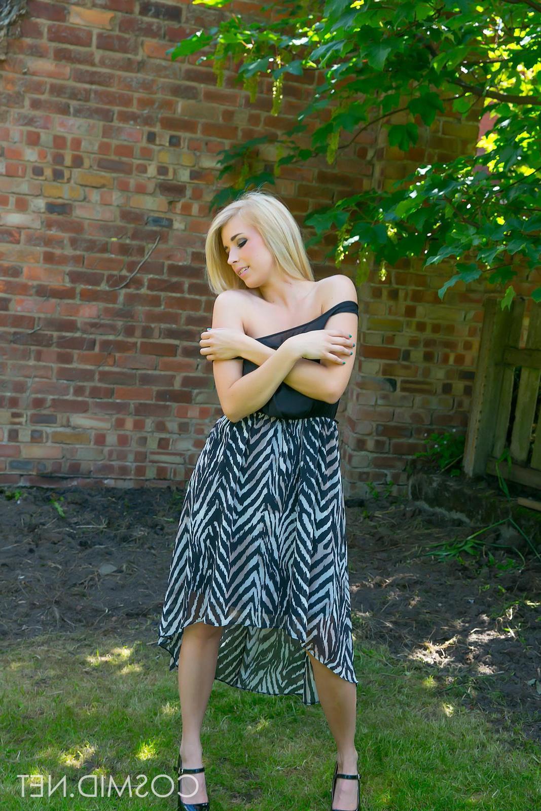 16P Busty babe Jodie strips off her black dress outside