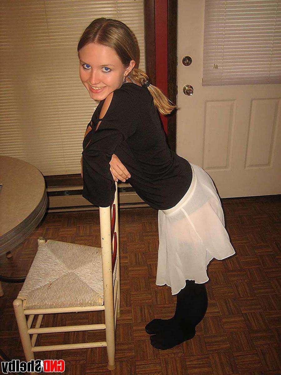 12P Horny teen Shelby strips off all but her black nylons and toys her tight little pussy