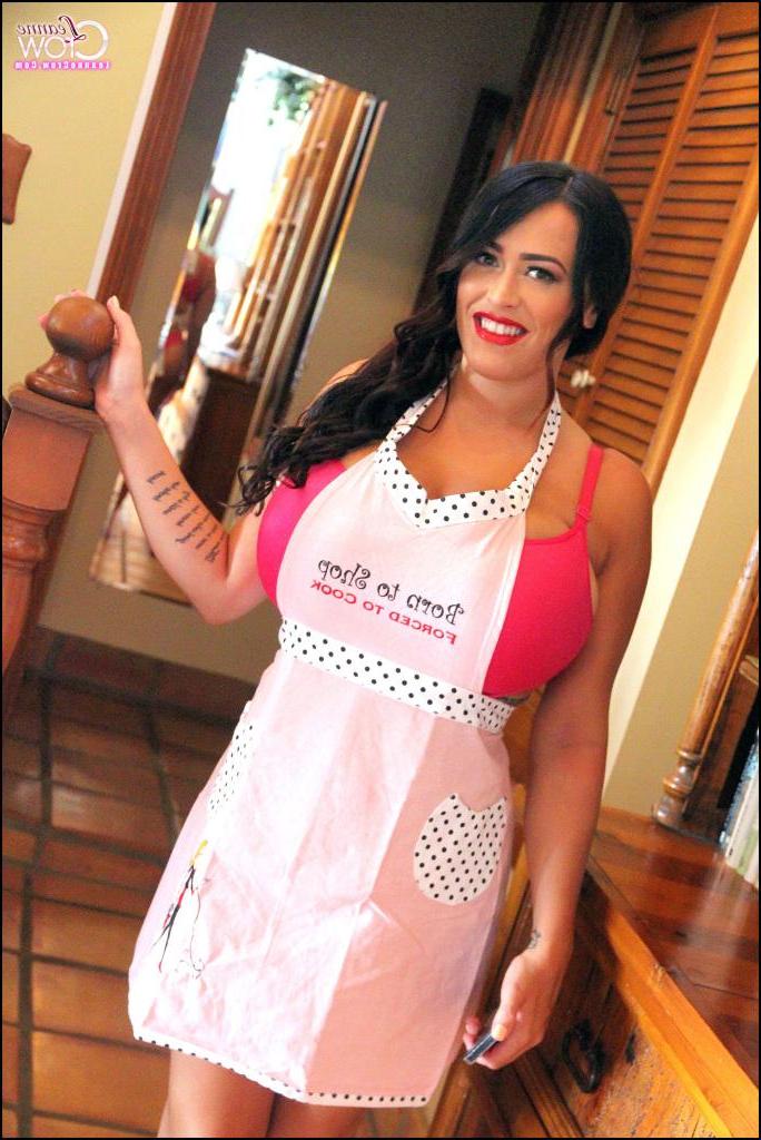 15P Busty pinup hottie Leanne Crow offers you up something delicious in the kitchen