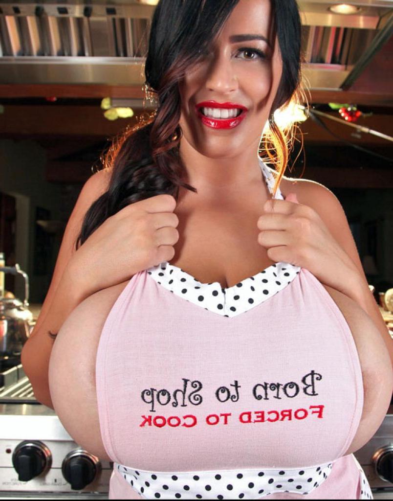 15P Busty pinup hottie Leanne Crow offers you up something delicious in the kitchen