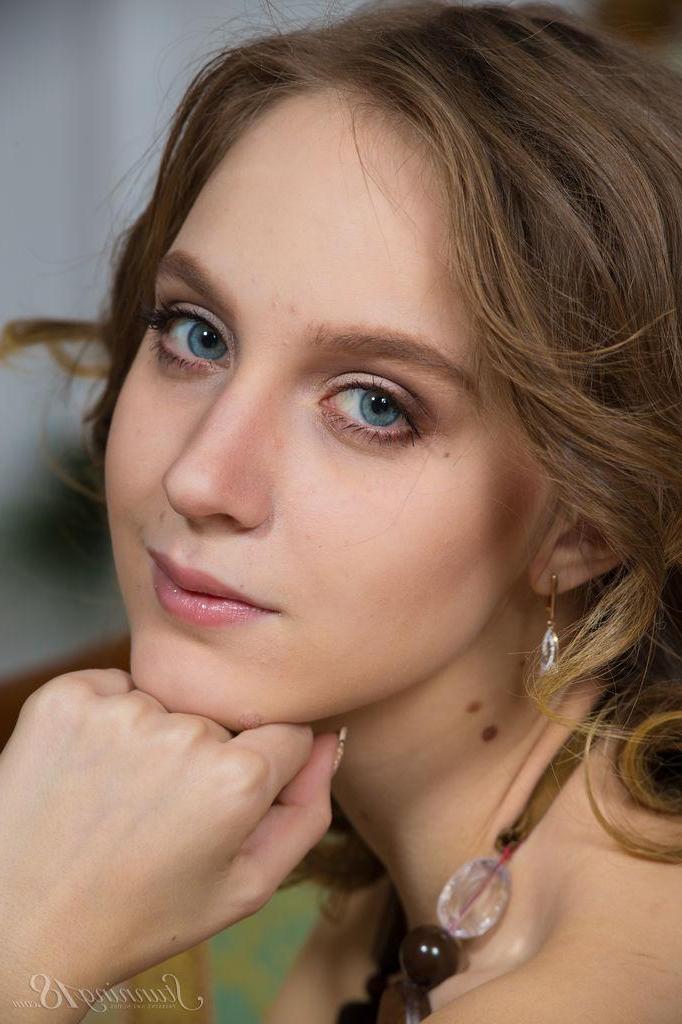 16P Pretty girl Linny strips nude for you in "Chair By The Fireplace"