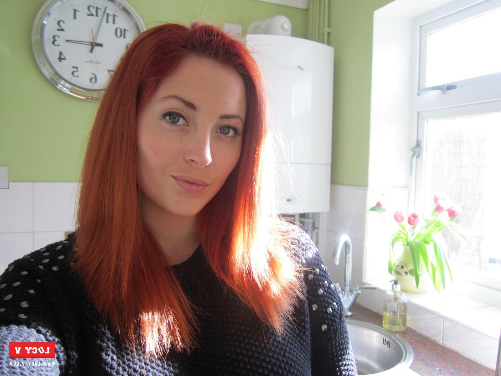 12P Sexy redhead model Lucy V strips in the kitchen just for you