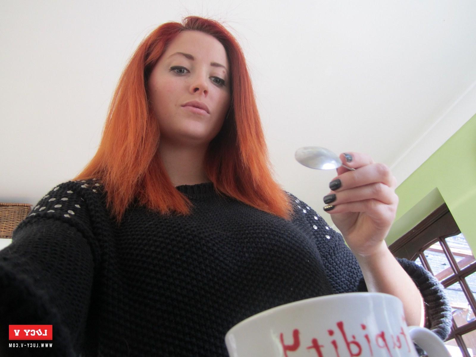 12P Sexy redhead model Lucy V strips in the kitchen just for you