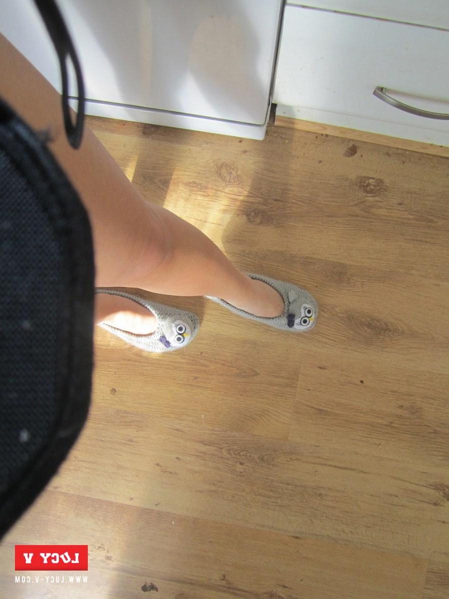 12P Sexy redhead model Lucy V strips in the kitchen just for you
