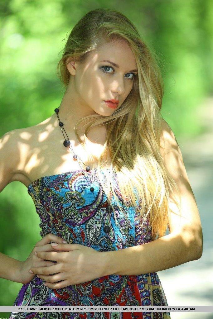 18P Pictures of blond beauty Madina A getting naked outside