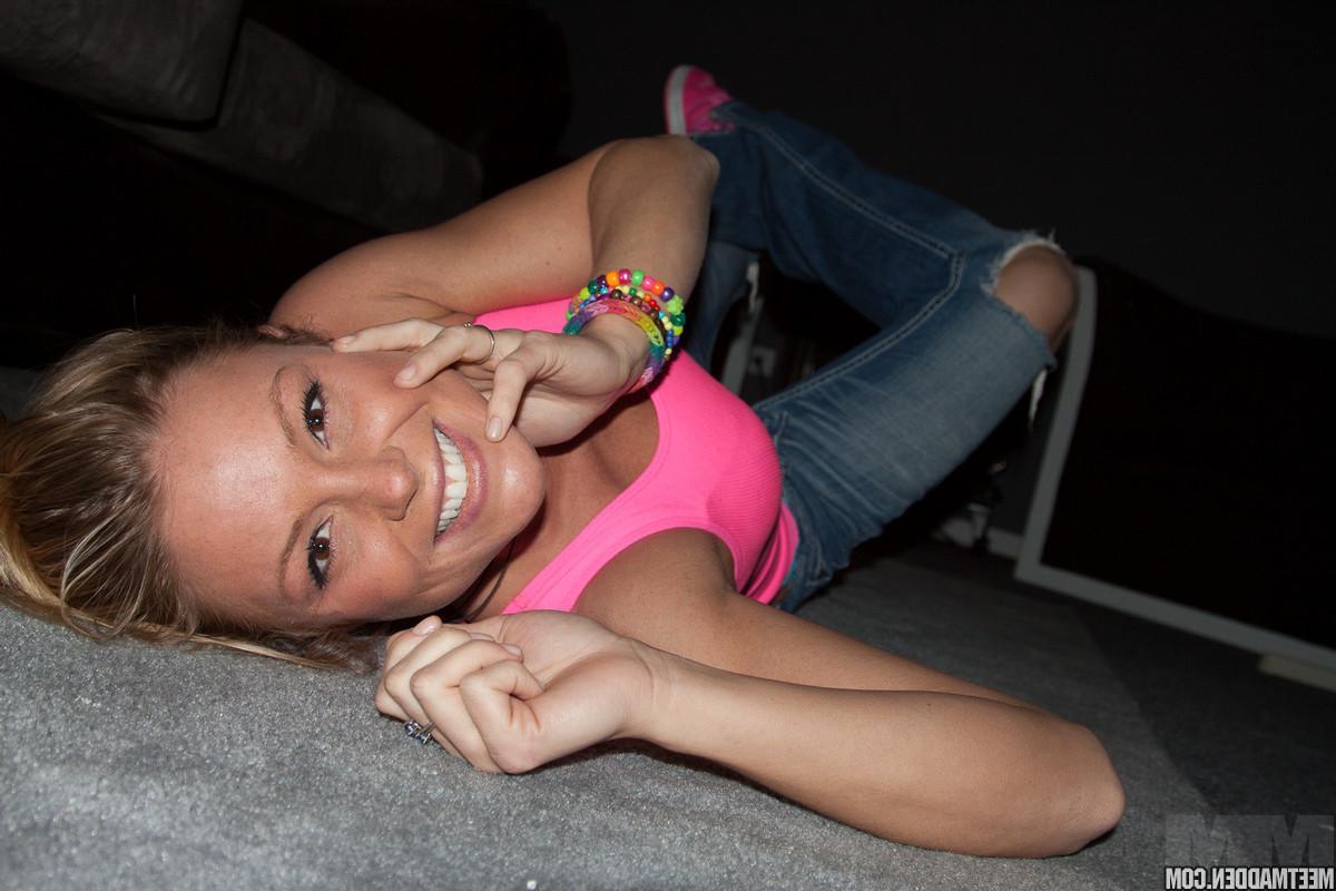 15P Blonde babe Madden struts around in her pink tank top and blue lace panties