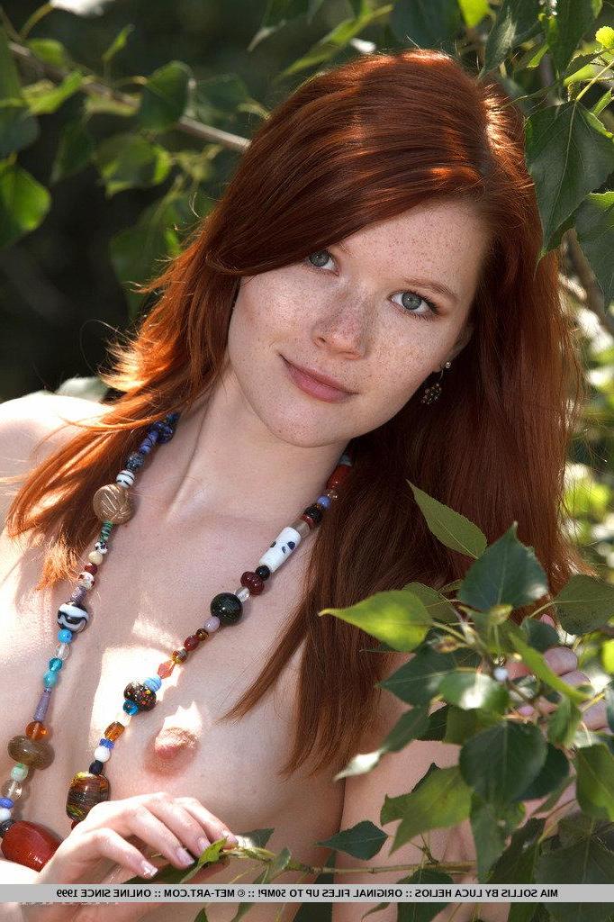 18P Pictures of stunning redhead teen Mia Sollis showing her tight pussy outside