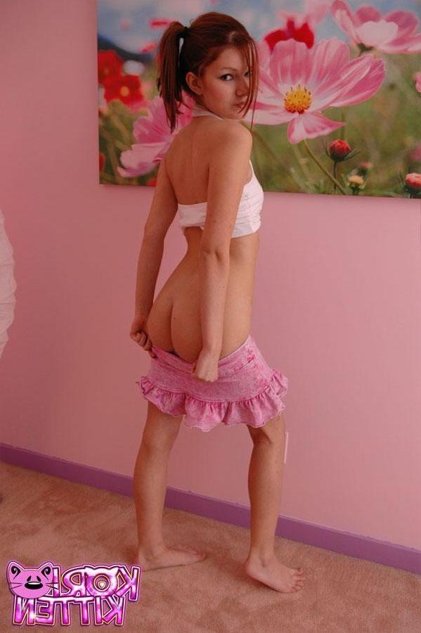 12P Redhead teen Kori Kitten teases and poses in her pink skirt
