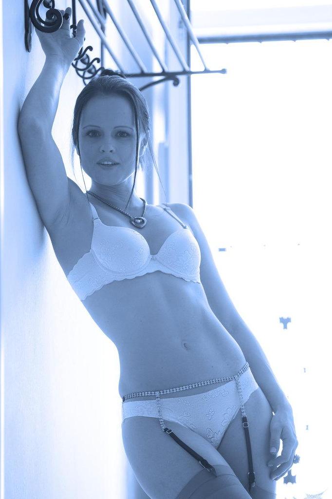 16P Brunette model Monica Sweet plays with her pussy in black and white