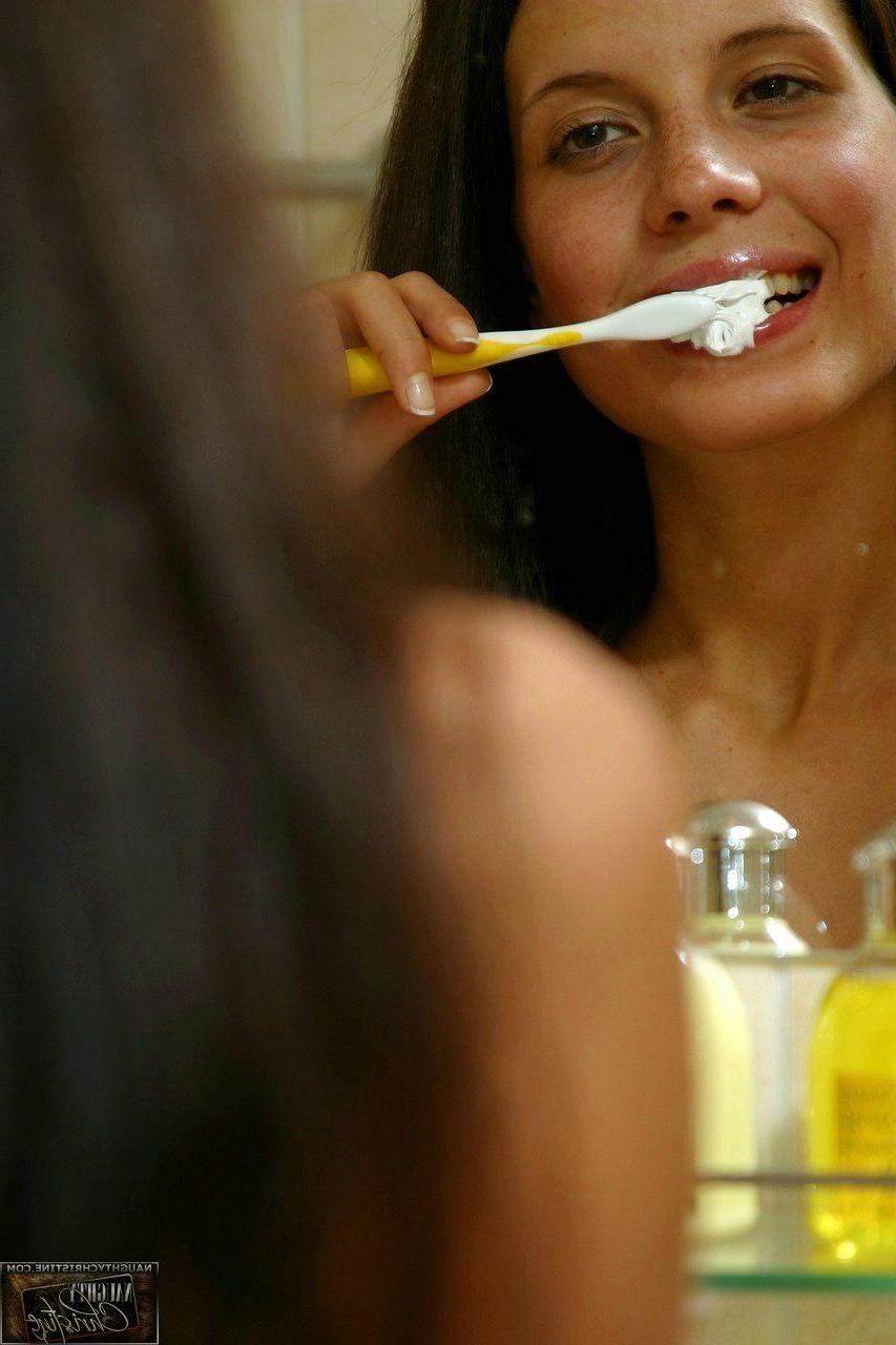 15P Pictures of teen chick Naughty Christine getting wet in the shower