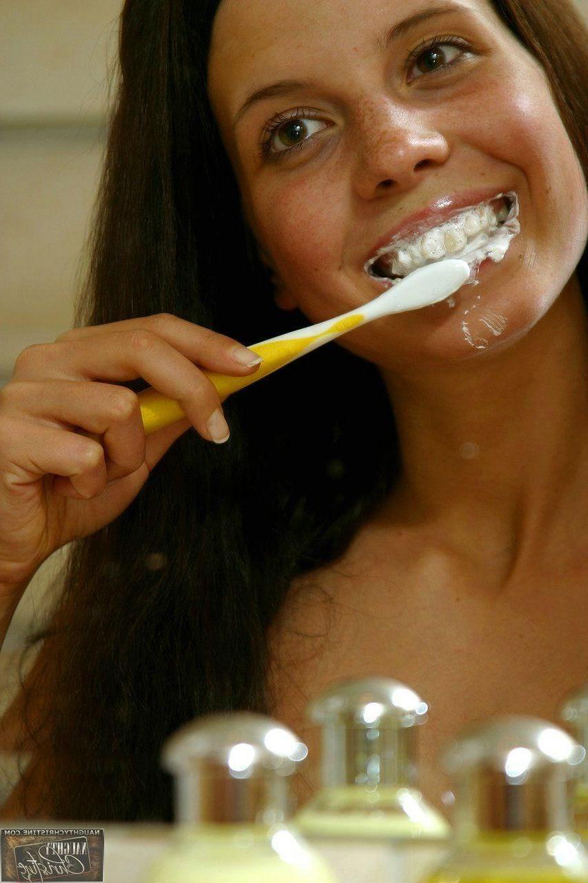 15P Pictures of teen chick Naughty Christine getting wet in the shower