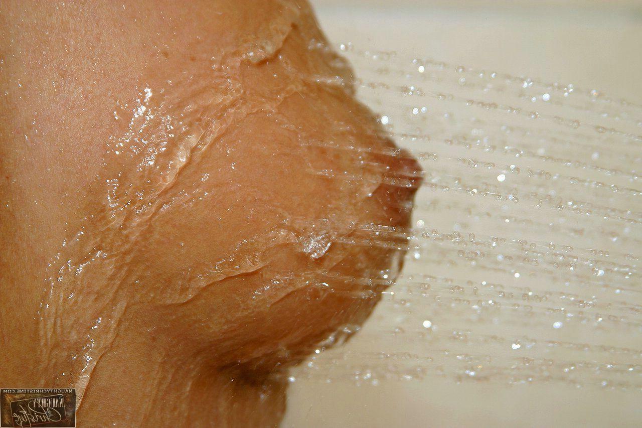 15P Pictures of teen chick Naughty Christine getting wet in the shower