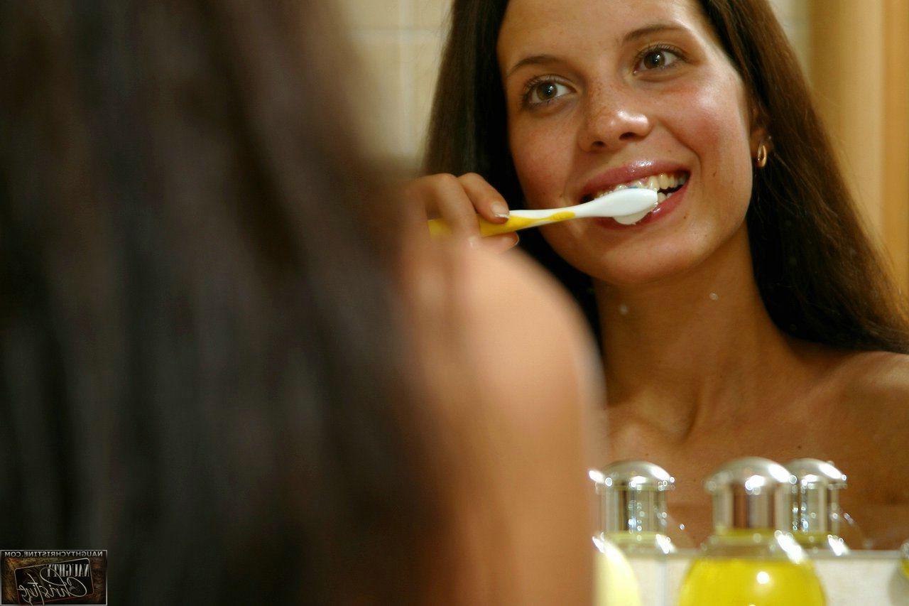15P Pictures of teen chick Naughty Christine getting wet in the shower