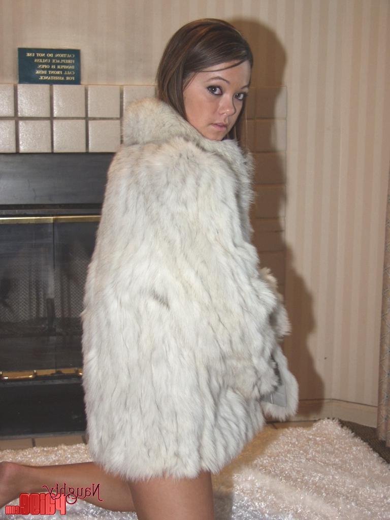 20P Pictures of Naughty Paige warming up by the fireplace