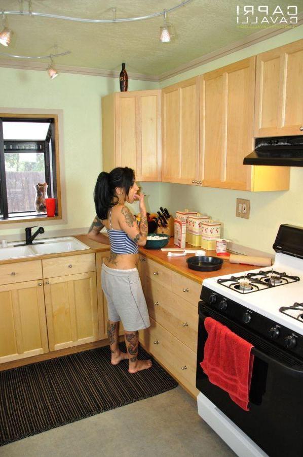 15P Pictures of Regan Reese licking pussy in the kitchen