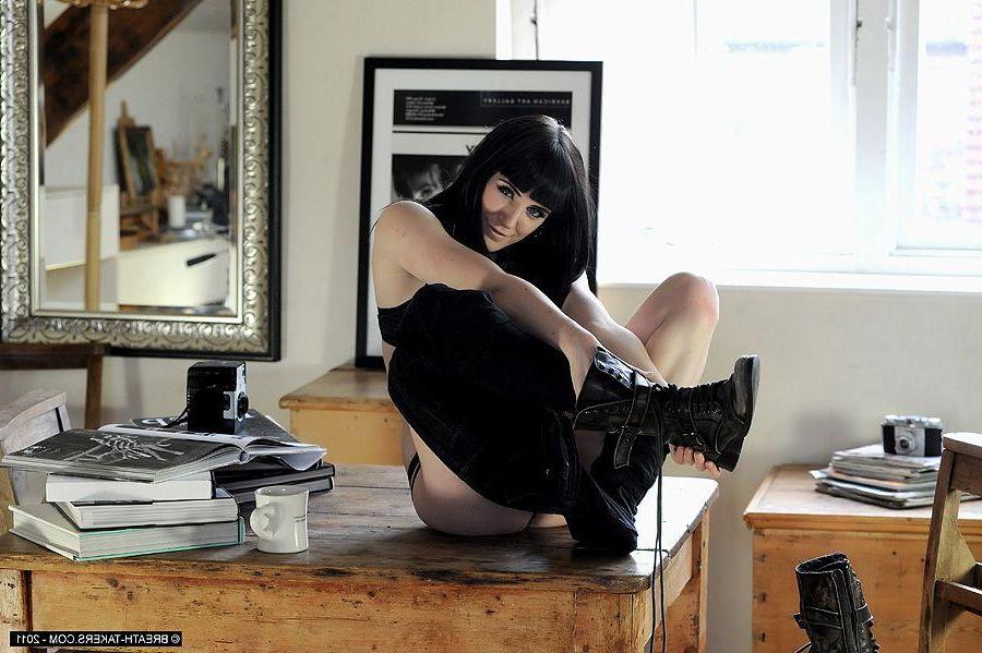 14P Pictures of a brunette girl stripping on the table