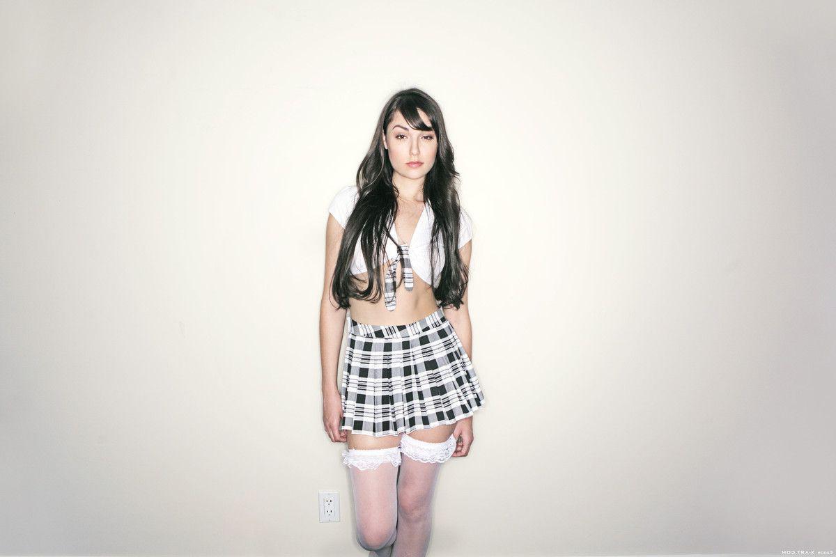 17P Pictures of a really hot brunette schoolgirl teasing with her body