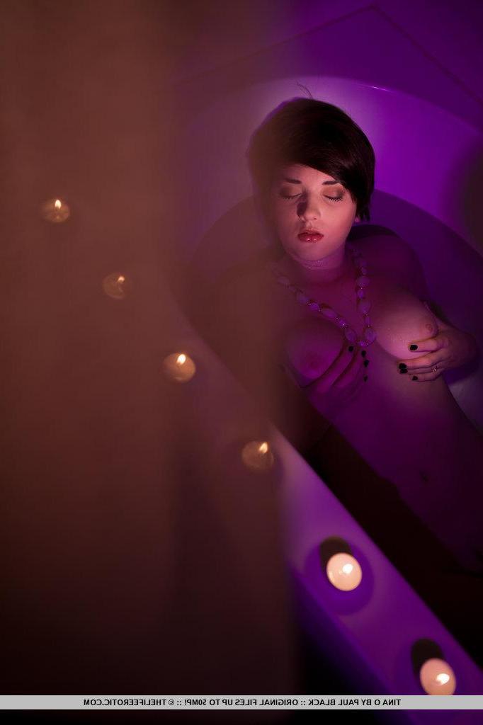 16P Pictures of brunette teen Tina O masturbating in candle-light