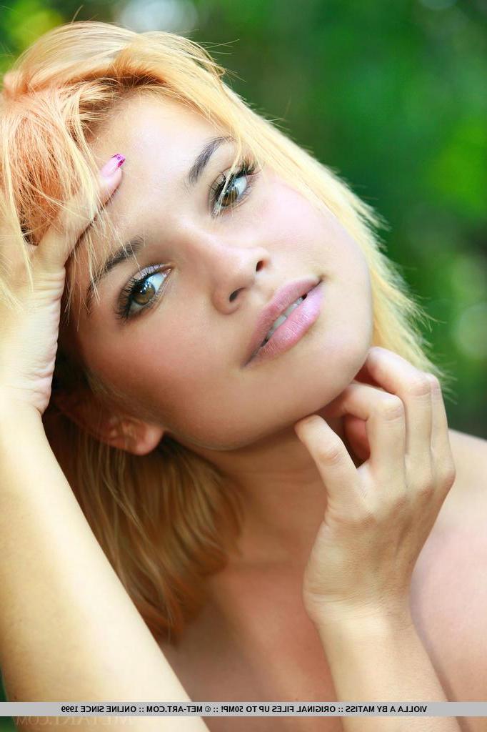 18P Redhead teen Violla A displays her nude body by the water