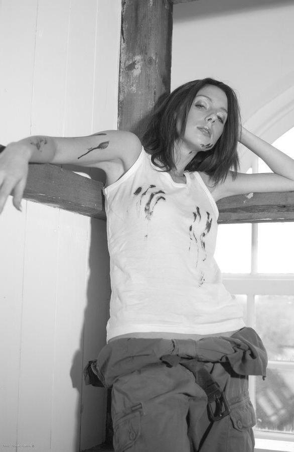 14P Pictures of a brunette girl showing her pussy