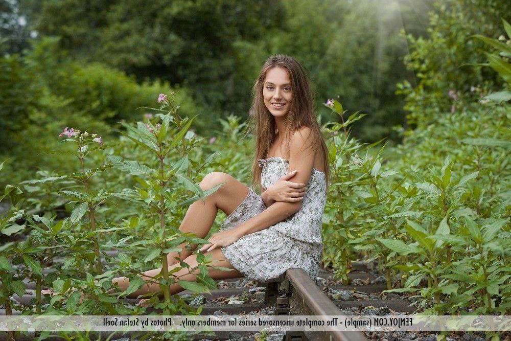 12P Pictures of a hot teen girl naked on the tracks