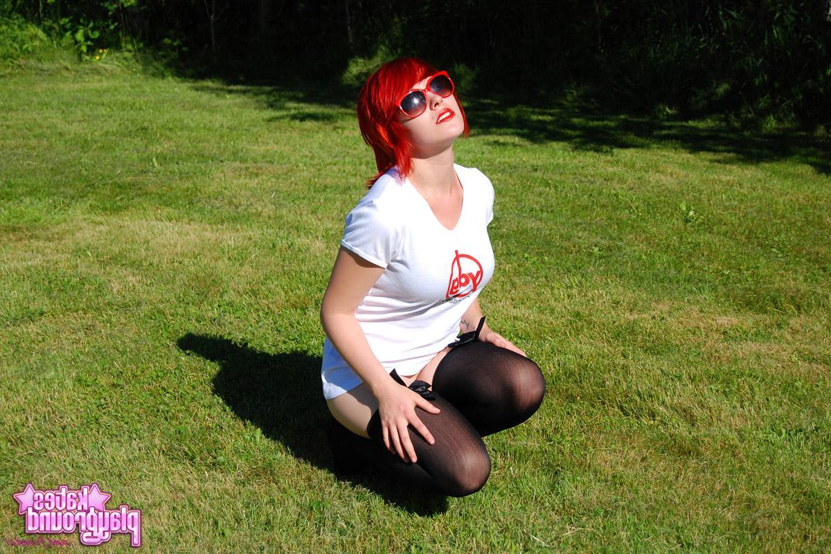 12P Redhead teen Sabrina teases as she dumps cold water all over her white shirt outdoors