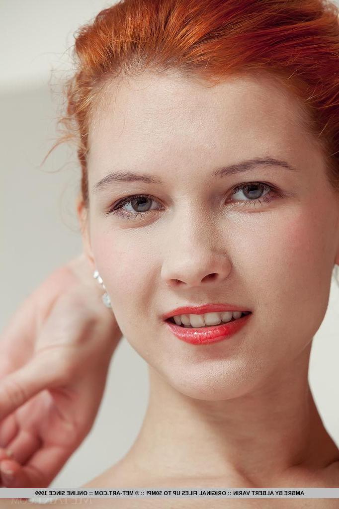 18P Redhead teen Ambre gets naked by the window in "Amenthi"