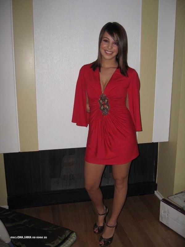 16P Hot brunette shows her cleavage in a sexy red dress