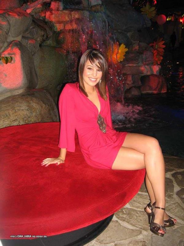 16P Hot brunette shows her cleavage in a sexy red dress