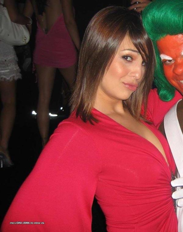 16P Hot brunette shows her cleavage in a sexy red dress