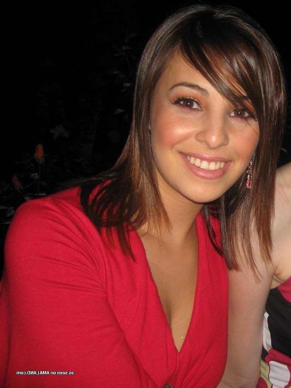16P Hot brunette shows her cleavage in a sexy red dress