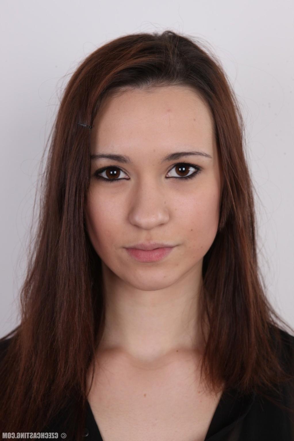 17P Young brunette poses for photo camera