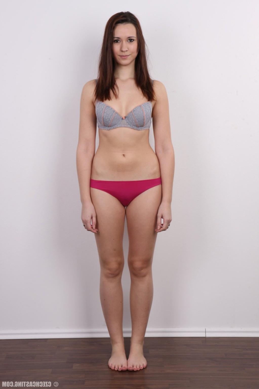 17P Young brunette poses for photo camera