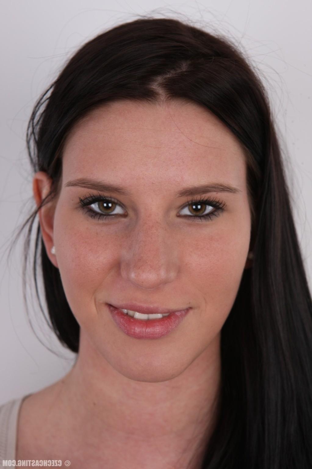 17P Tall brunette poses for photo camera