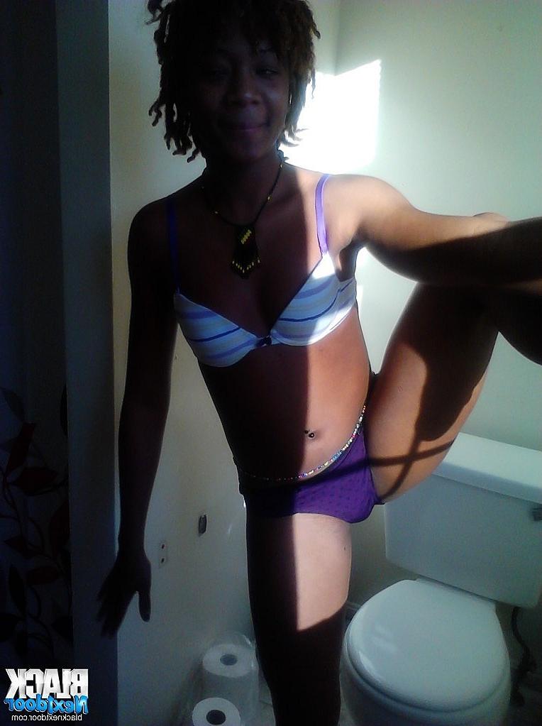 8P Black teen with small tits posing in the sun lights
