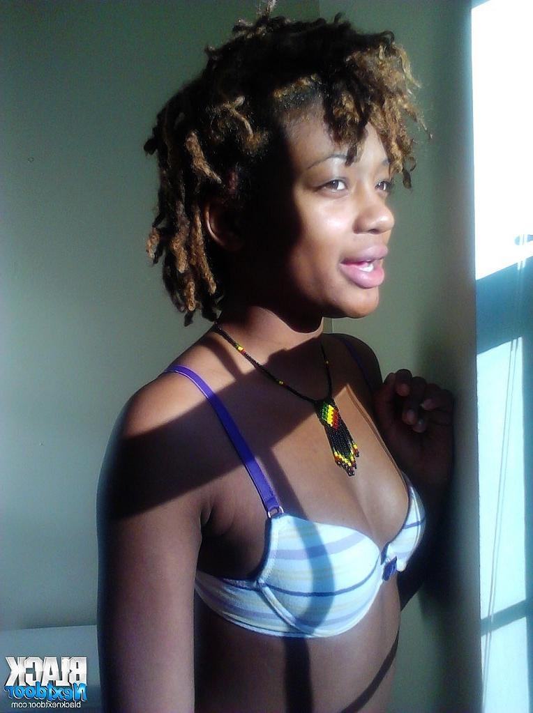 8P Black teen with small tits posing in the sun lights