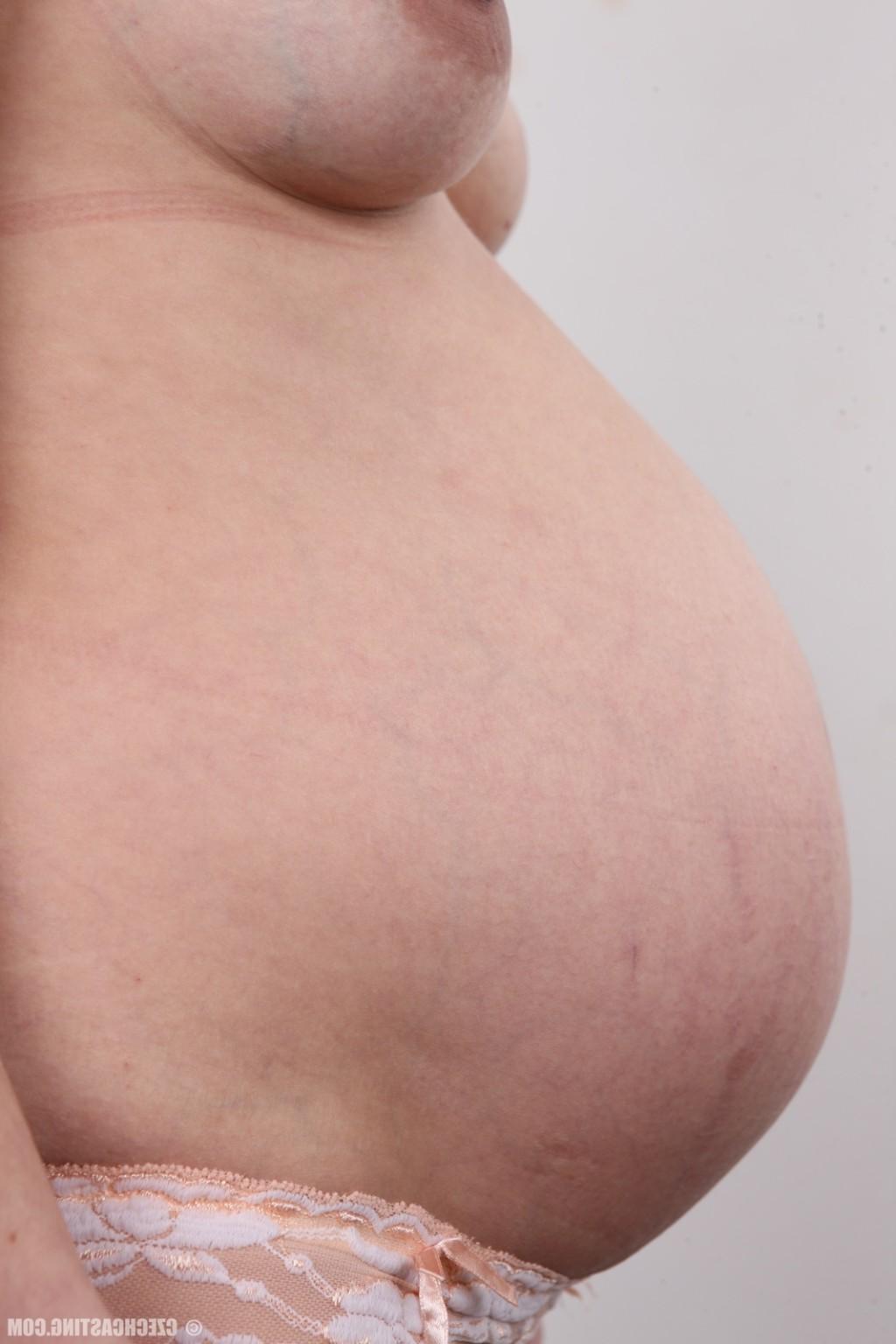 17P Pregnant brunette poses nude