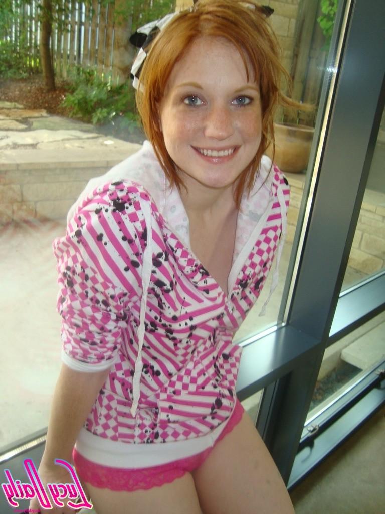16P Big boob amateur redhead puts tits on window