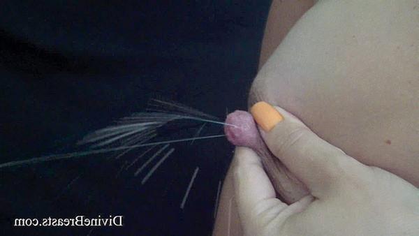 15P Closeups of a lactating babe squirting milk from tits