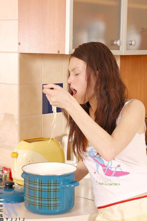 13P Topless teen brunette took time to relax and strip in the kitchen counter