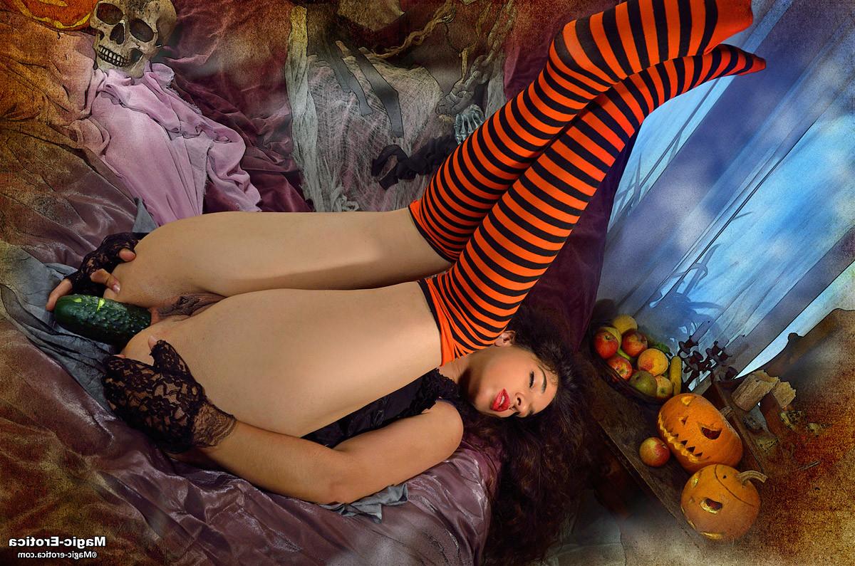 14P Brunette babe toying her holes with a cucumber in Halloween nigh