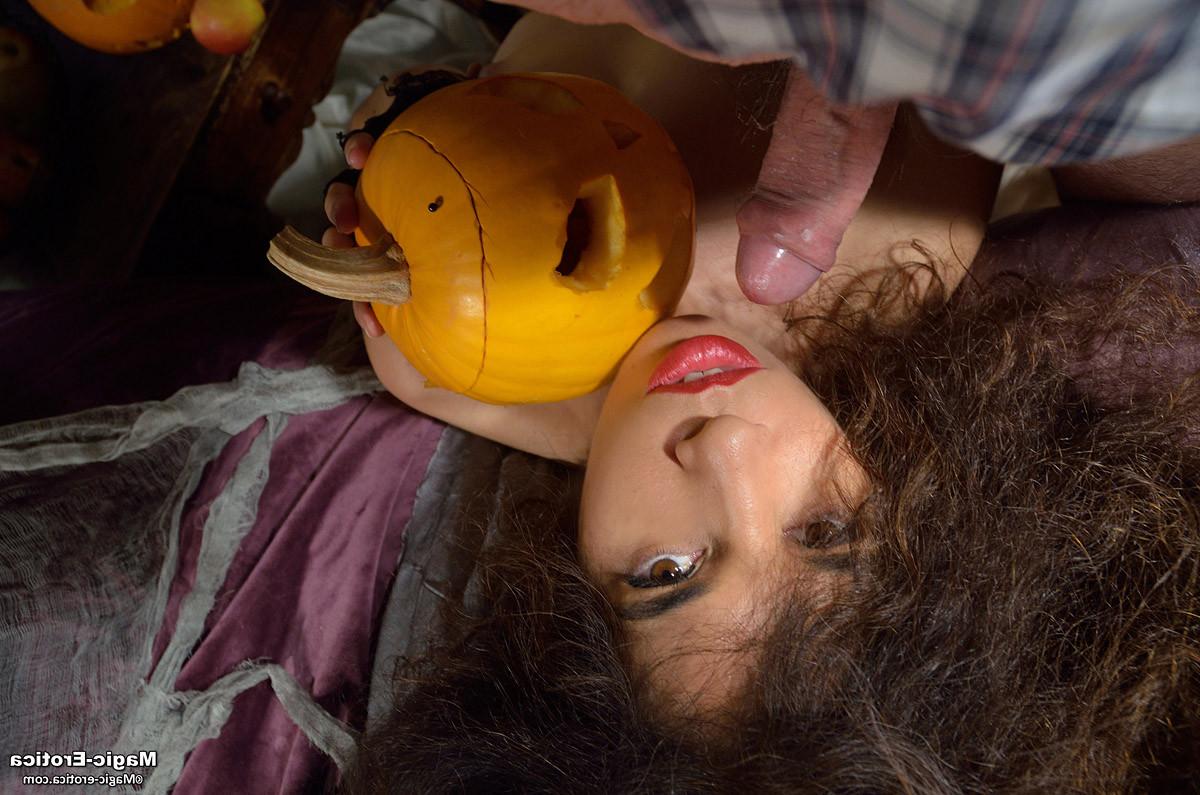 14P Brunette babe toying her holes with a cucumber in Halloween nigh