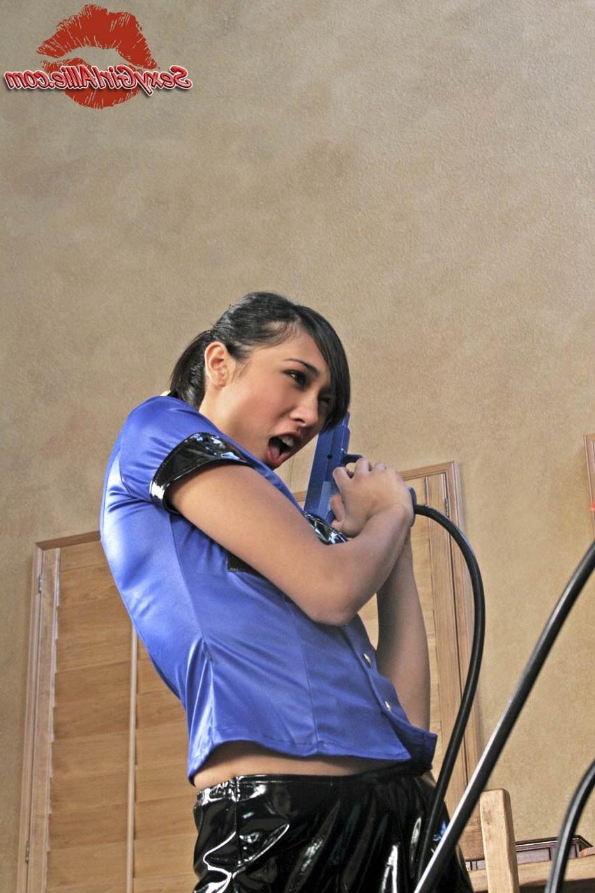 15P Skinny asian teen girl plays with gun