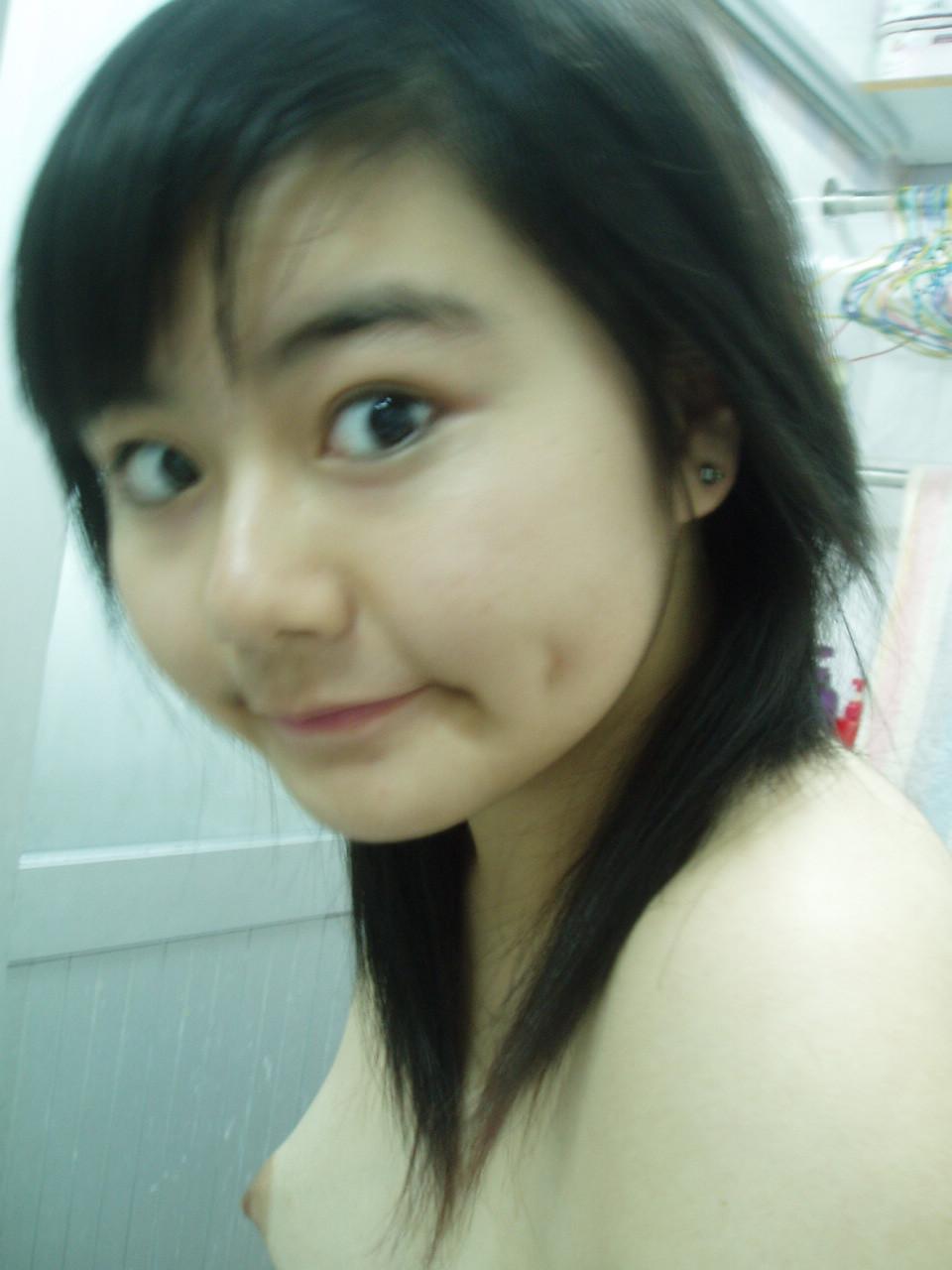 15P Asian teen girlfriends posing for the camera