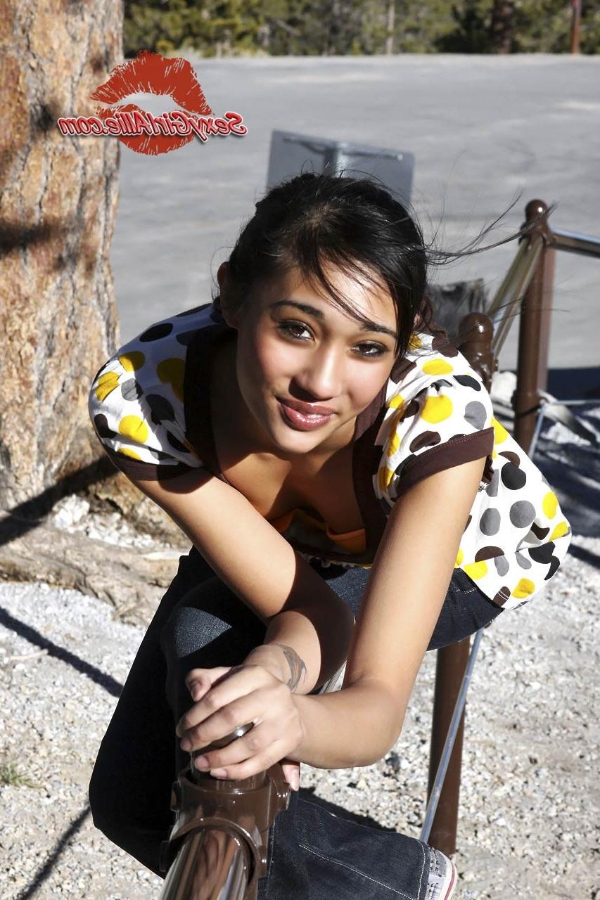 16P Skinny asian teen girl outdoors