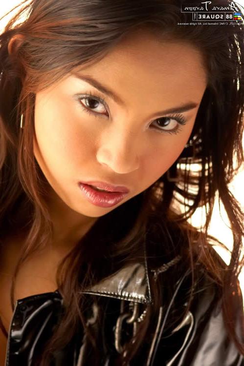 15P Asian hottie wearing a kinky black outfit