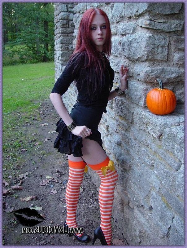15P Hot gothic babe Liz plays with a pumpkin