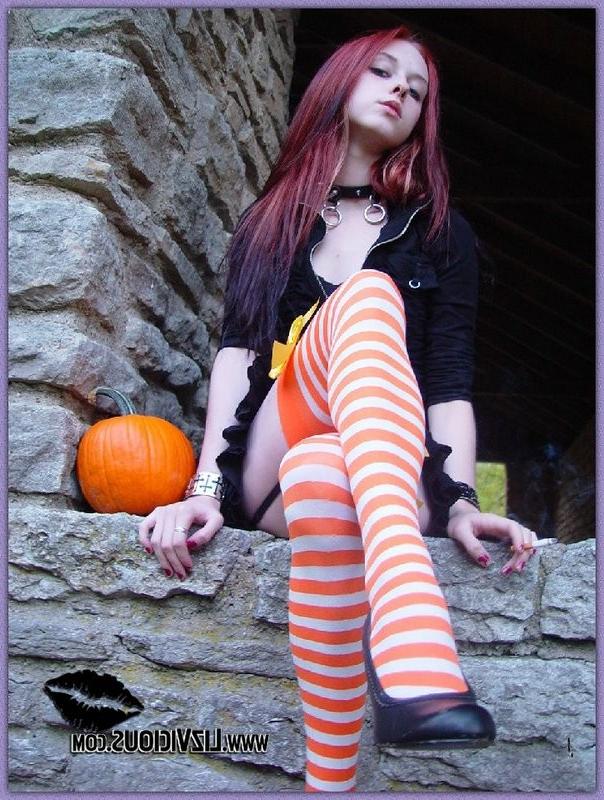 15P Hot gothic babe Liz plays with a pumpkin