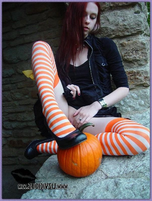 15P Hot gothic babe Liz plays with a pumpkin