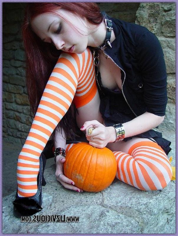 15P Hot gothic babe Liz plays with a pumpkin